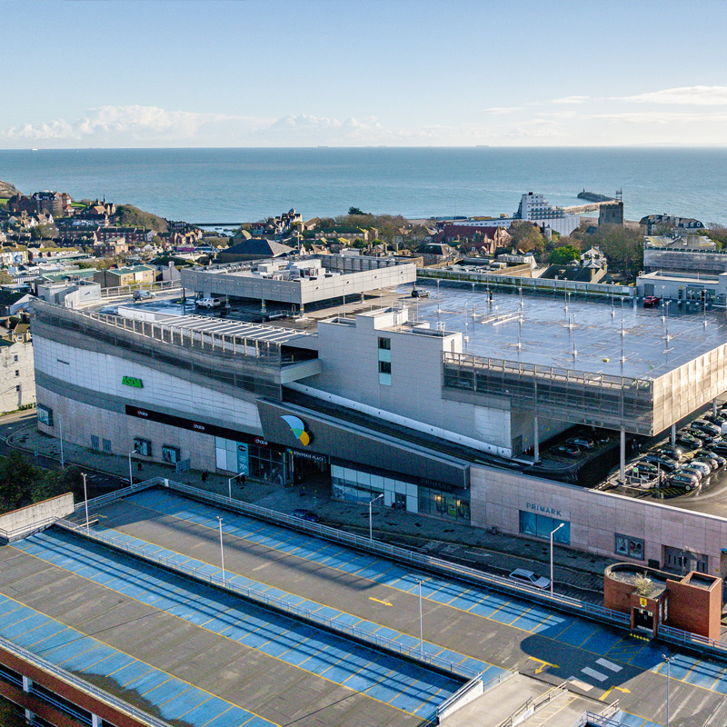Aerial photo of Bouverie Place Shopping Centre with Folkestone beach in the background